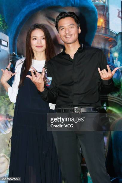 Director Stephen Fung and his wife actress Shu Qi attend the premiere of film "The Adventurers" on August 22, 2017 in Hong Kong, China.