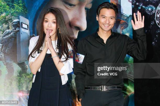 Director Stephen Fung and his wife actress Shu Qi attend the premiere of film "The Adventurers" on August 22, 2017 in Hong Kong, China.