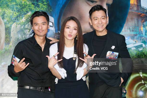 Director Stephen Fung, his wife actress Shu Qi and actor/producer Andy Lau attend the premiere of film "The Adventurers" on August 22, 2017 in Hong...