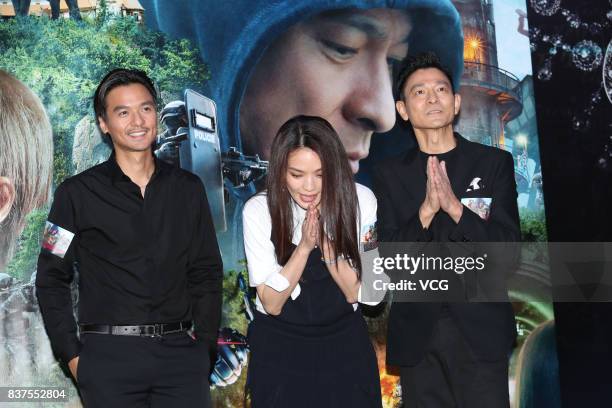 Director Stephen Fung, his wife actress Shu Qi and actor/producer Andy Lau attend the premiere of film "The Adventurers" on August 22, 2017 in Hong...