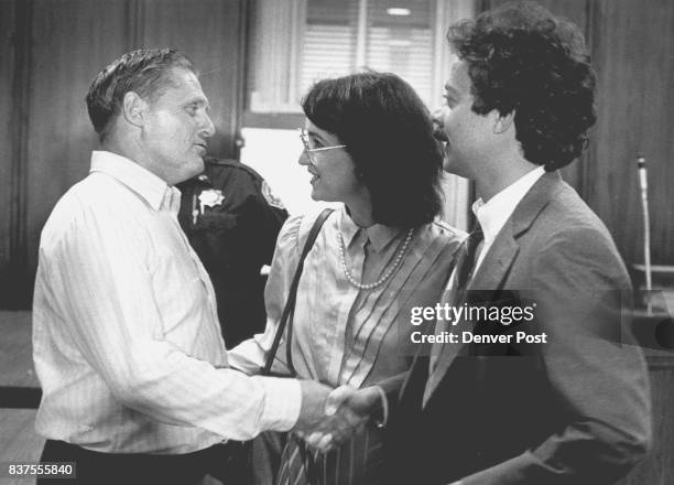 Buster Snider is congratulated by his lawyer Buster Snider shakes hands with his attorney Stave Polidori, right, and is congratulated by Terri Brake,...