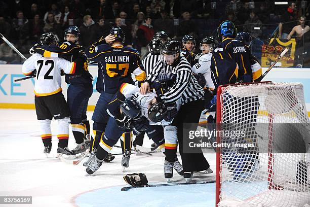 Mikael Kurki of Espoo Blues fights for the puck during the IIHF Champions Hockey League match between Espoo Blues and SC Bern on November 19, 2008 in...