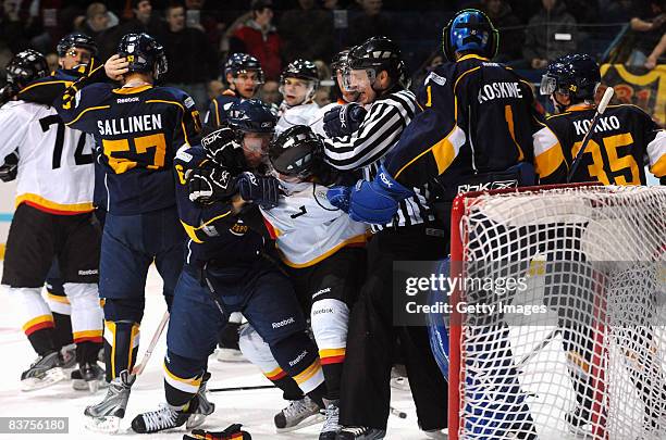 Mikael Kurki of Espoo Blues fights for the puck during the IIHF Champions Hockey League match between Espoo Blues and SC Bern on November 19, 2008 in...