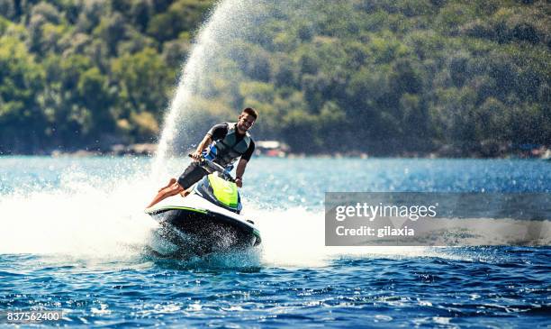 jet skiing. - jet ski stock pictures, royalty-free photos & images