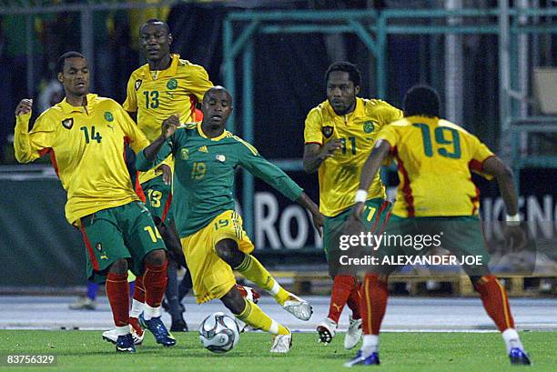 Bafana Bafana´s Tsepo Masilela rushes past Cameroon' s players during the annual Nelson Mandela Challenge soccer game at Olympia Park in Rustenburg...