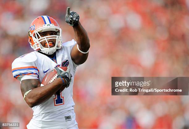Running Back Percy Harvin of the Florida Gators runs for a touchdown against the Georgia Bulldogs at Jacksonville Municipal Stadium on November 1,...