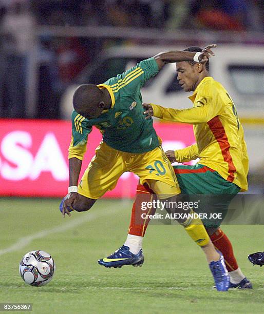 Bafana Bafana´s Siboniso Gaxa is tackled by Cameroon' s Mbani Modeste during the annual Nelson Mandela Challenge soccer mgame at Olympia Park,in...