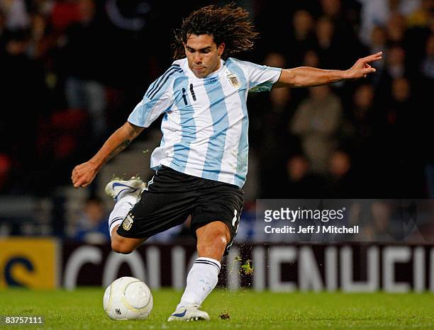 Carlos Tevez of Argentina shoots at goal during the international friendly match between Scotland and Argentina at Hampden Park, November 19, 2008 in...