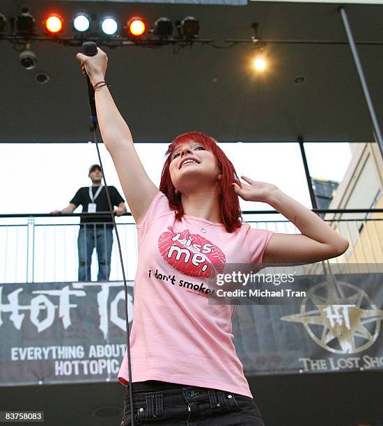 Hayley Williams of Paramore performs onstage in conjunction with the cast of "Twilight" in-store autograph signing at Hot Topic store at Hollywood &...