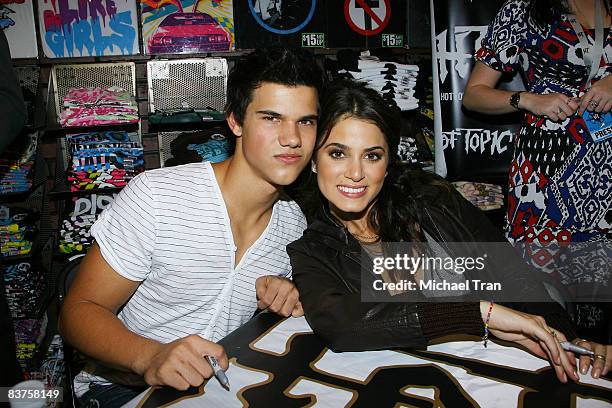 Actors Taylor Lautner and Nikki Reed of the cast of "Twilight" attend an in-store autograph signing at Hot Topic store at Hollywood & Highland...