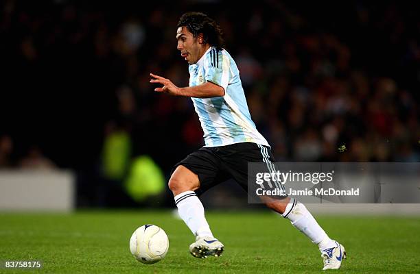 Carlos Tevez of Argentina runs with the ball during the International Friendly match between Scotland and Argentina at Hampden Park on November 19,...