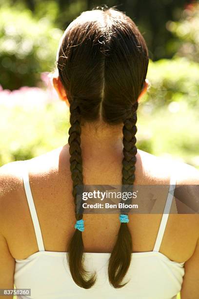 back of woman's head with braides - trenzado fotografías e imágenes de stock