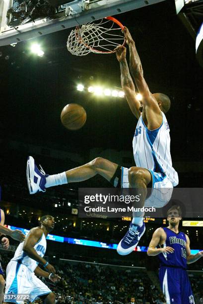 Tyson Chandler of the New Orleans Hornets dunks on Beno Udrih of the Sacramento Kings on November 19, 2008 at the New Orleans Arena in New Orleans,...