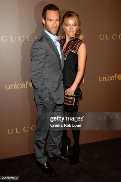 Chris Diamantopoulos and Becky Newton attend the launch of Gucci's Tattoo Heart Collection to benefit UNICEF at Gucci's 5th Avenue store on November...