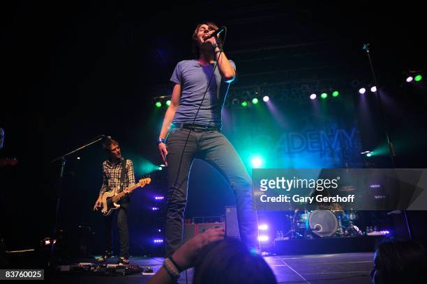 Bassist Adam Siska, lead singer William Beckett, and drummer Andy Mrotek of the rock band The Academy Is, performs live on stage at the Roseland...