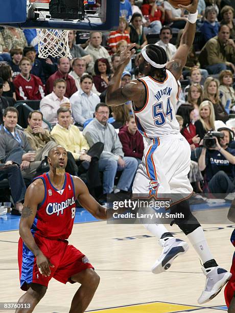 Chris Wilcox of the Oklahoma City Thunder goes up for a dunk against Brian Skinner of the Los Angeles Clippers at the Ford Center on November 19,...