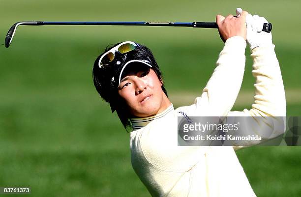 Ryo Ishikawa of Japan hits his approach shot on the 15th hole during first round of Dunlop Phoenix Tournament 2008 at Phoenix Country Club on...