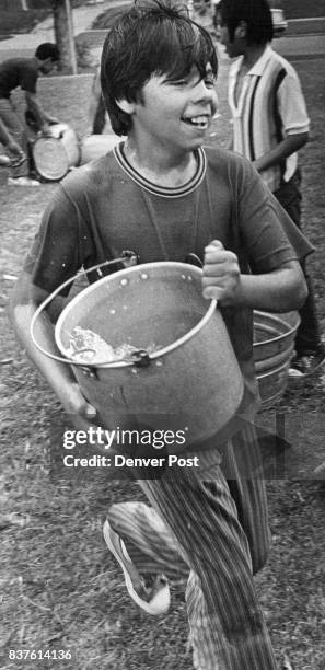 Ronnie Reyes Conejos St., Arms Himself with water Credit: Denver Post