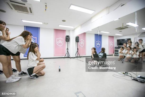 Dance instructor, center, watches as contestants practice dance moves during the production of the "Idol School" reality television show by CJ E&M...