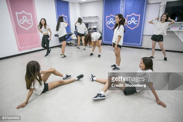 Contestants stretch during a dance practice session during the production of the "Idol School" reality television show by CJ E&M Corp. At the...