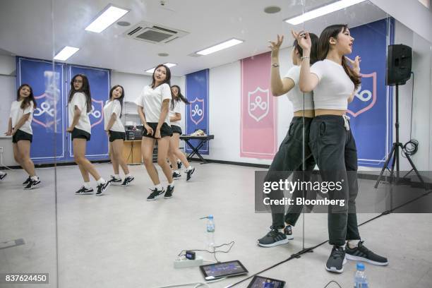 Dance instructor, right, watches as contestants practice dance moves during the production of the "Idol School" reality television show by CJ E&M...