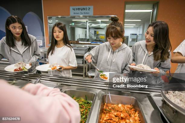 Contestants choose food inside the cafeteria set during the production of the "Idol School" reality television show by CJ E&M Corp. At the Yangpyeong...