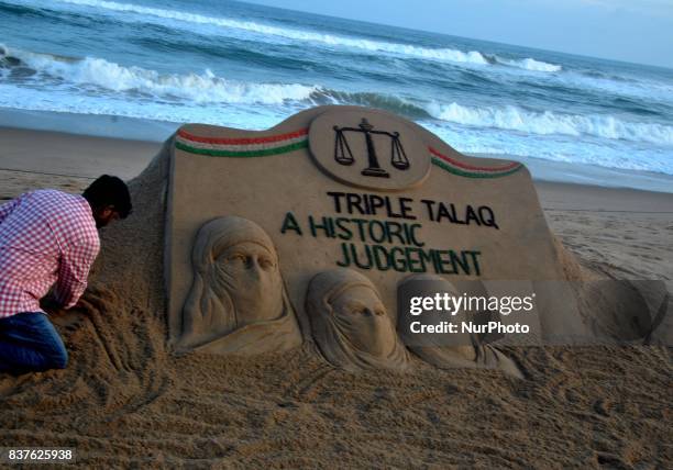 Sand art is seen at the Bay of Bengal, Sea's eastern coast beach as it created by Indian sand artist Sudarshan Patnaik for public awareness about the...