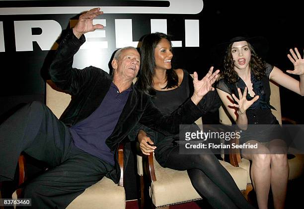 Photographer Peter Beard and model Emanuela de Paula attend the press conference of the 2009 Pirelli calendar launch and dinner gala at Hotel Adlon...