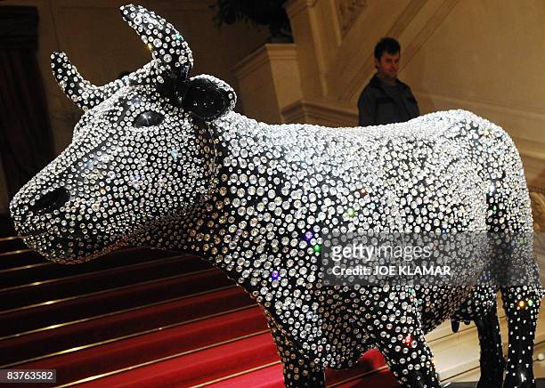 The 'European Crystal Cow,' set by Swarowski crystals and owned by a Hungarian gallery, welcomes visitors at the Austrian exhibition Luxury Saloon in...