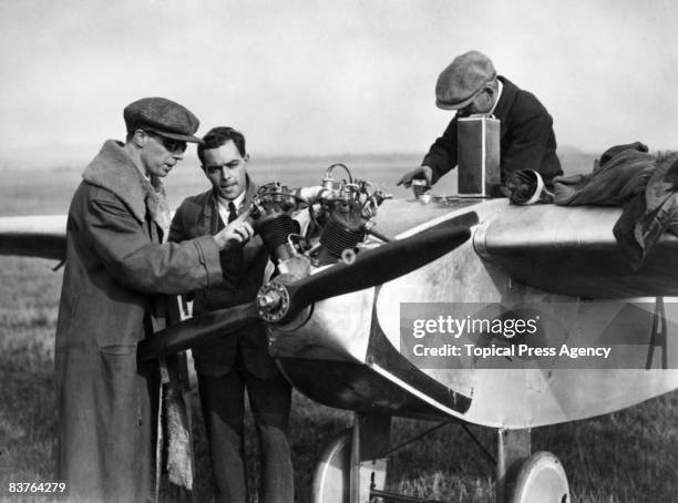 Aviator and inventor Bert Hinkler and Professor Lowe examine an Avro monoplane motor-glider during the light aircraft trials at Lympne in Kent,...