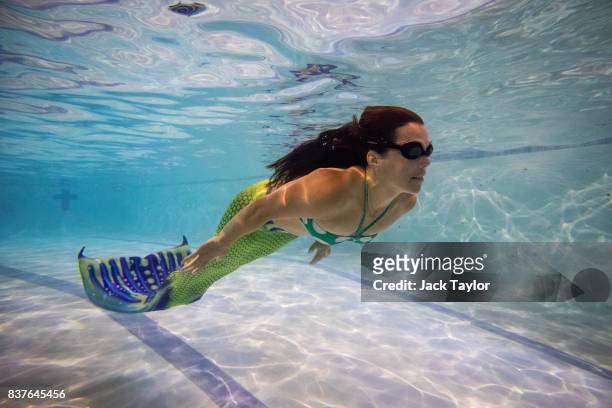 Mermaiding student Annabel Canavan swims during a Mayim Mermaid Academy lesson at the swimming pool at Bournemouth Collegiate School on August 19,...