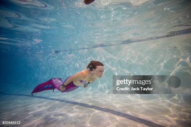 Mermaiding student Alessandra Cattaneo swims during a Mayim Mermaid Academy lesson at the swimming pool at Bournemouth Collegiate School on August...