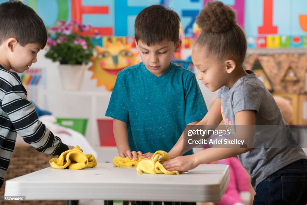 Preschoolers Helping Clean Classroom High-Res Stock Photo - Getty Images