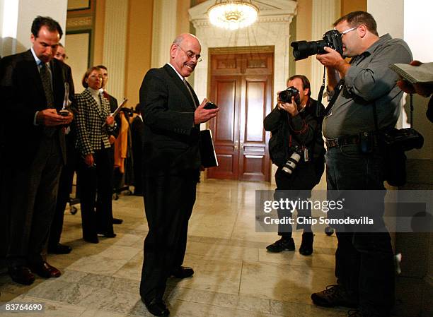 House Oversight and Government Reform Committee Chairman Henry Waxman checks his Blackberry after the House Democratic Caucus meeting on Capitol Hill...