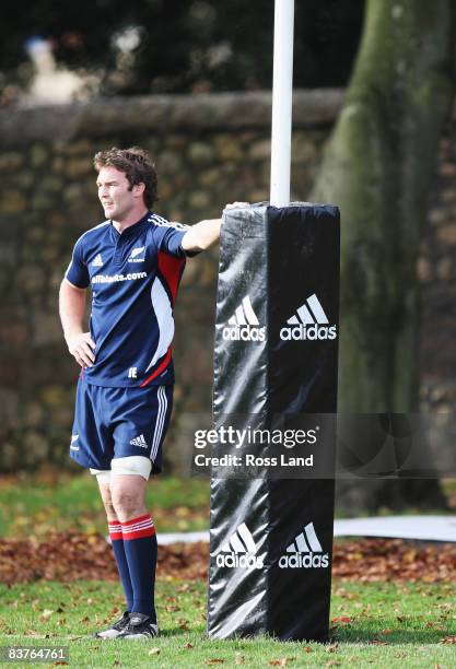 Jason Eaton of the All Blacks leans on the goal post during a New Zealand All Black training session at Sophia Gardens on November 20, 2008 in...