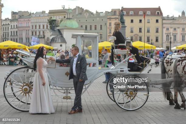 More and more newly weds from Krakow, Poland and around the world have their wedding pictures taken in Krakow's Main Market Square and around the Old...