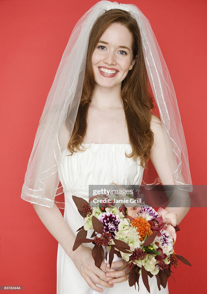 Portrait of bride with red background