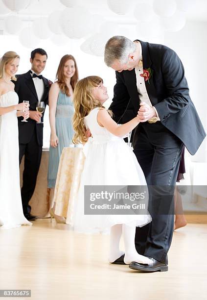 flower girl dancing on fathers feet at wedding - flower girl stock pictures, royalty-free photos & images