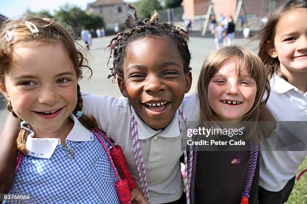 school friends laughing together - schoolgirl stock pictures, royalty-free photos & images