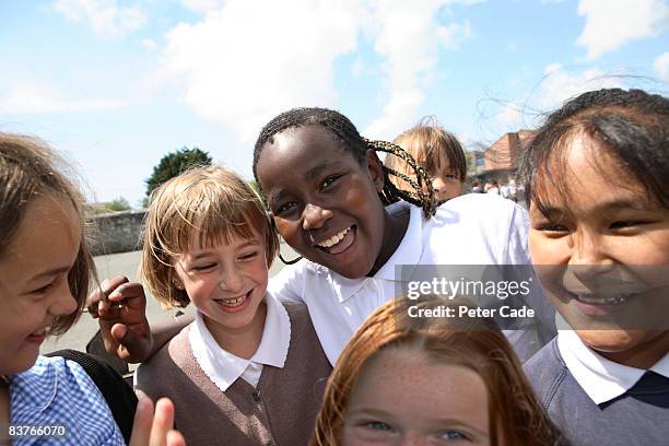 school friends laughing together - only girls stock pictures, royalty-free photos & images