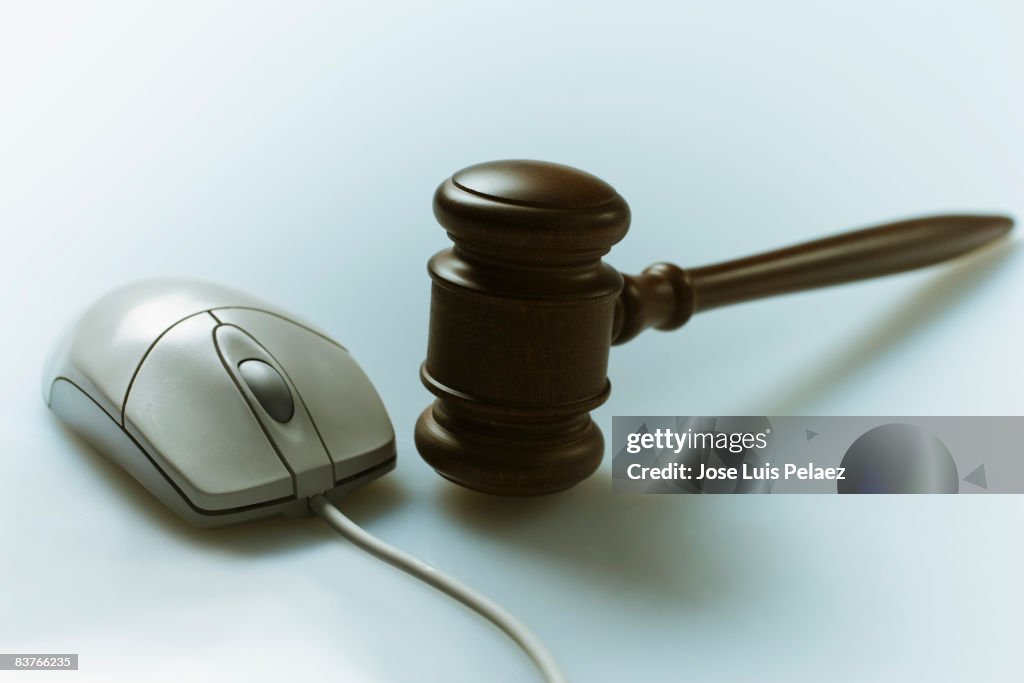 Computer Mouse beside judge's gravel