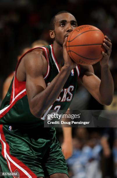 Luc Richard Mbah a Moute of the Milwaukee Bucks takes a free throw against the Denver Nuggets at the Pepsi Center on November 18, 2008 in Denver,...
