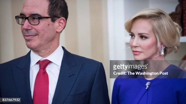 President Donald Trump speaks as Steven Mnuchin, his fiancee Louise Linton, and Vice President Mike Pence participate in a ceremonial swearing in for...