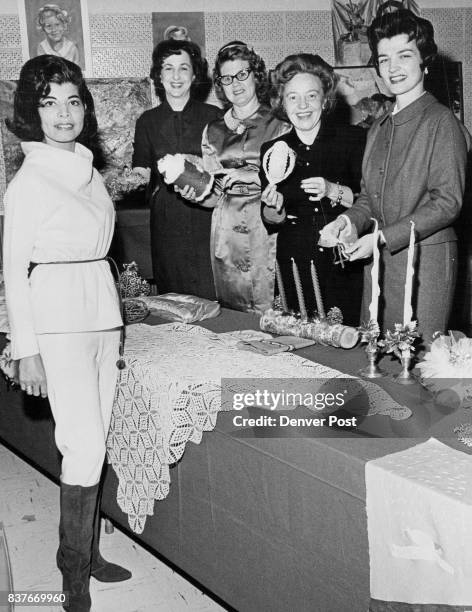 Left to right are Mrs. Johnny C. Harrod, who modeled clothing; Mrs. Charles B. Meurer, Mrs. William Ringo III, president; Mrs. Patrick Tucker, and...