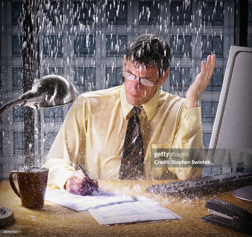 Grumpy Manager Getting Rained On Businessman Being Rained On In His Office High-Res Stock Photo - Getty ...
