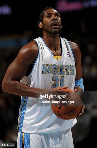 Nene of the Denver Nuggets takes a free throw against the Milwaukee Bucks at the Pepsi Center on November 18, 2008 in Denver, Colorado. The Nuggets...