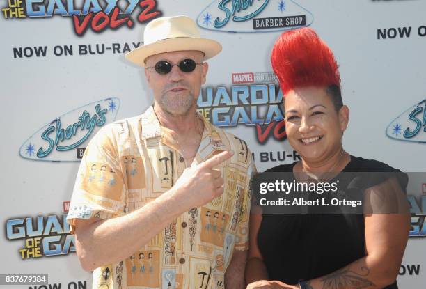 Actor Michael Rooker poses with fans with Yondu mohawks at Disney's Celebration for the Release Of "Guardians Of The Galaxy Vol. 2" Blu-ray held at...