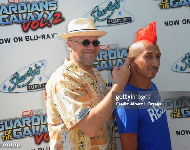 Actor Michael Rooker poses with fans with Yondu mohawks at Disney's Celebration for the Release Of "Guardians Of The Galaxy Vol. 2" Blu-ray held at...