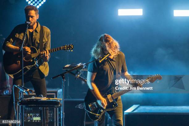 Bassist and cellist Brent Kutzle and guitarist Drew Brown of OneRepublic perform live on stage at White River Amphitheatre on August 22, 2017 in...