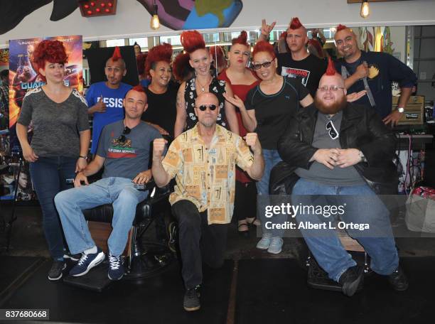 Actor Michael Rooker poses with fans with Yondu mohawks at Disney's Celebration for the Release Of "Guardians Of The Galaxy Vol. 2" Blu-ray held at...